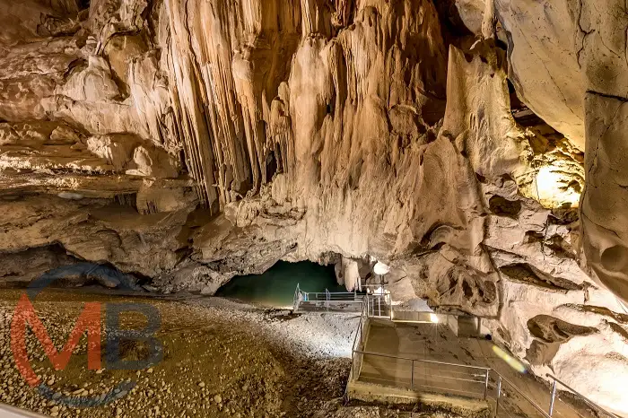 View inside Al Hoota Cave near Nizwa (Wilayat), Ad Dakhiliyah Governorate, featuring stalactites, stalagmites, and an underground lake walkway