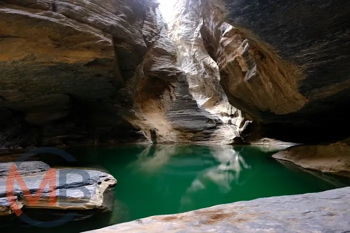 Wadi Al Nakhr: a stunning natural wonder at the base of Jebel Shams in Wilayat Al Hamra (District), Ad Dakhiliyah Governorate, known as the “Grand Canyon of Oman” with rugged landscapes, traditional villages, and adventure opportunities